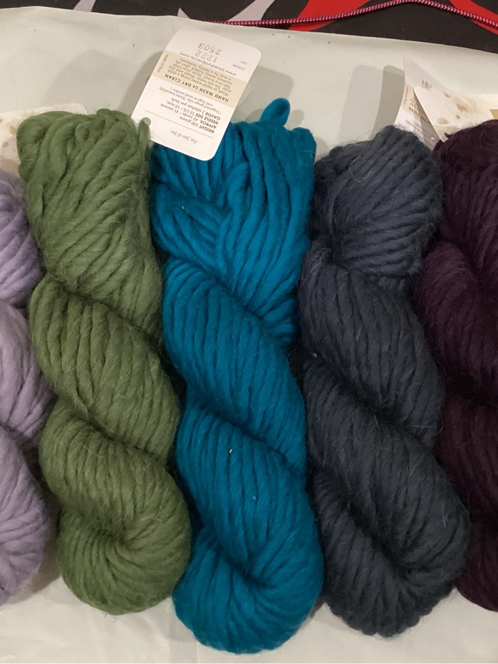 5 hanks of blue sky alpaca bulky weight yarn in coordinating colorway